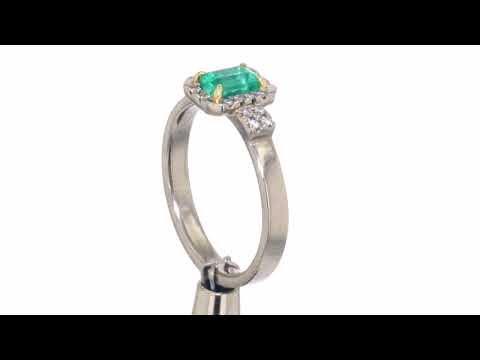 Emerald and diamond white gold ring